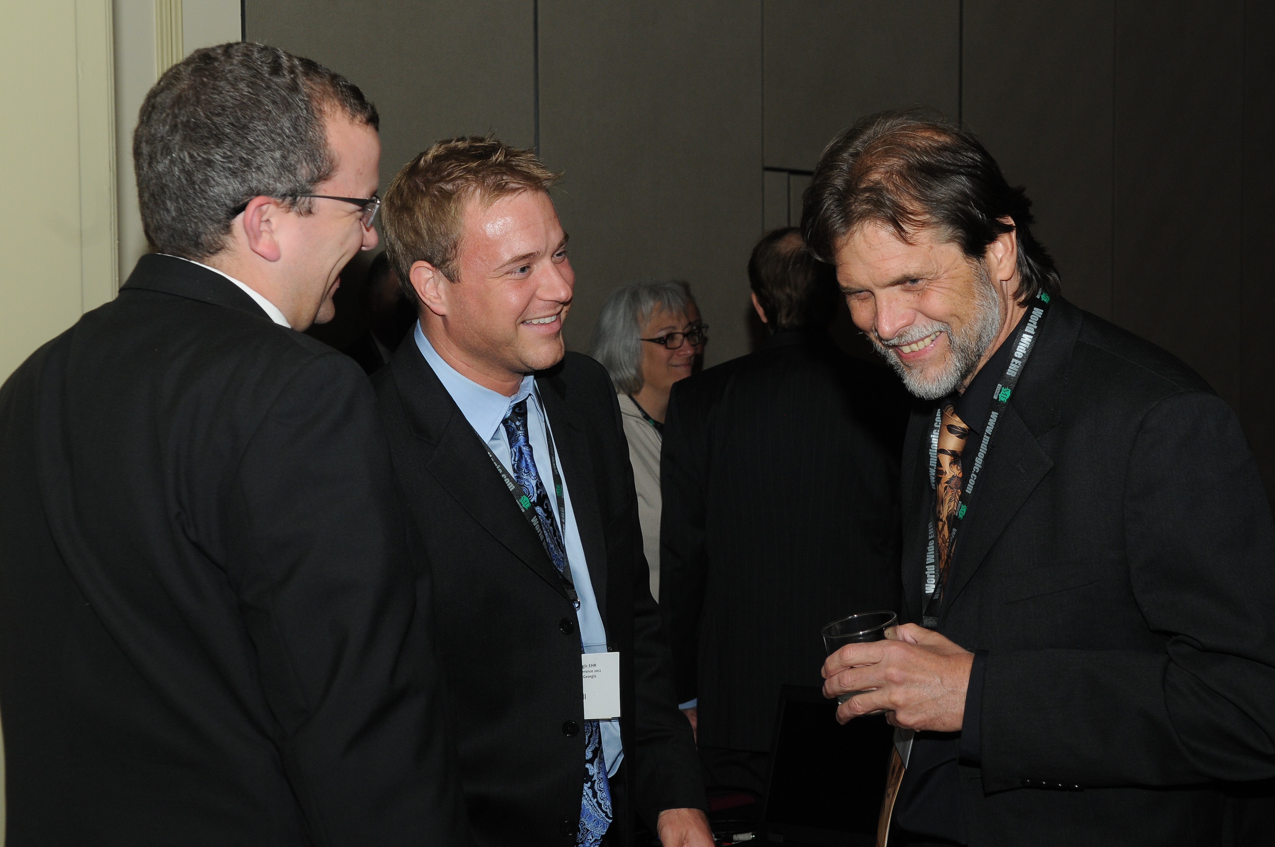 Chad Lewis, Tom Cahill and Dave Castles Enjoying the Conference